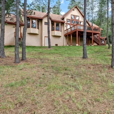 Luxury home on the golf course with spacious deck overlooking the mountains