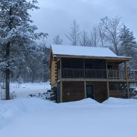Isolated Log Cabin with Panoramic Views of Cherry Pond and White Mountains