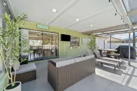Charming 2-bedroom house with pool and fenced in backyard. Sleeps 8