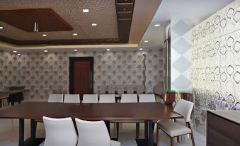 a conference room with a long wooden table , chairs , and patterned wallpaper , ready for meetings or presentations at Hotel 8th Planet