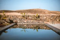 An architectural oasis with large swimming pool, along a breath-taking scenery. - Wifi