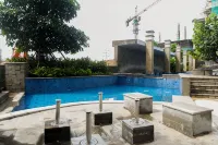 1BR near Mall at Grand Sungkono Lagoon Apartment By Travelio - Apartments