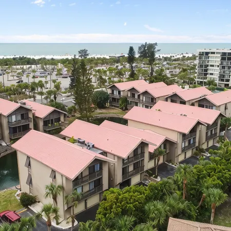 Steps to#1 Rated Beach in USA Spacious2+2Condo,Pool,GarageTranquil Setting