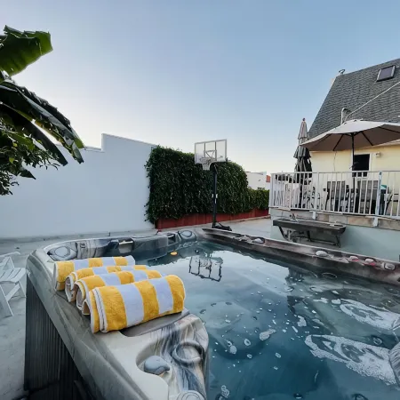 Family-friendly summer vacation home with big hot tub 2 blocks from beach.