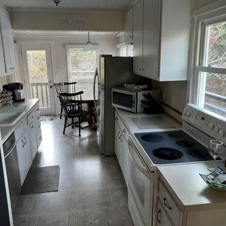 Cozy Cottage with access to and partially obstructed views of the bay.