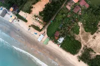 Nasya's Beach Side Cottages - Beach