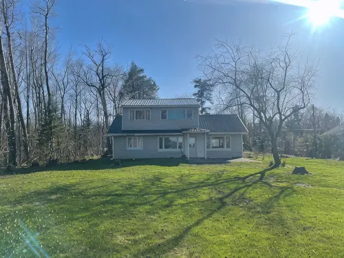 Charming house on the St. Mary's river in Sault Ste. Marie, freighters out front