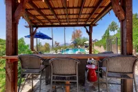 A private oasis to relax and play in the comfort of a gated 2-acre estate.