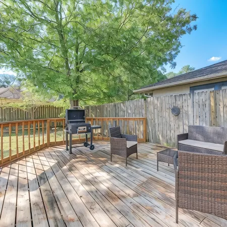 King bed with Pool table, decked patio and, gym.