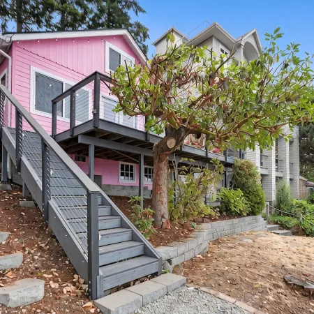 Darling pink beach house with epic views in a cozy community.