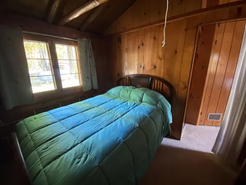 Cozy rustic cabin perched above Ocqueoc Lake