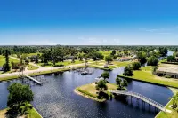 Newly Remodeled 4BR/3BR Canal Front Retreat w/ Pool Near Golf Course & Beach FL - 4-Star