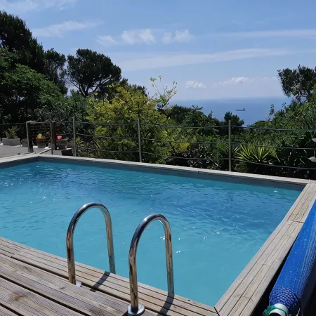 Top of villa, terraces, swimming pool at Mont St Clair, pétanque court with sea view