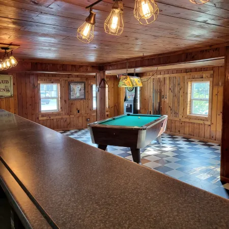 Former bar with games, multiple kitchens, 5 bedrooms, sleeps 14.