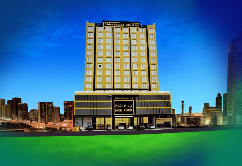 "a tall , yellow building with the logo "" plaza tower "" on it is surrounded by green grass" at Nooh Tower