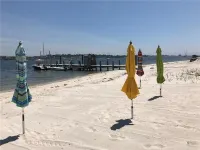 Beachfront Bliss: Water Front, Steps to Sand, Minutes from Dining & Attractions!