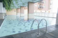 1BR near Gedebage Station at Tamansari Panoramic Apartment By Travelio