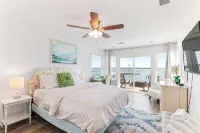 Waterfront home with dock, heated pool, & spectacular views- walk/bike downtown!