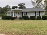 Charming house with a large fenced lot in a central location