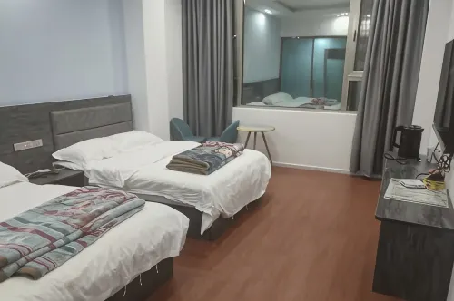 Xuanwei Guihuaxiang Hotel - Homestays