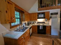 Cozy cabin with wrap around porch and only minutes to town!