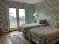 Beachfront home directly across from beach & park! Close to everything!