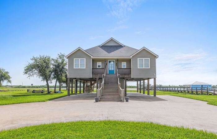 REEL N  REST in Hackberry LA ! Waterfront home with beautiful views .