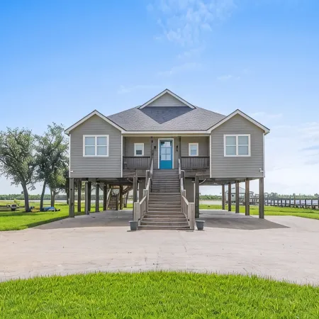 REEL N  REST in Hackberry LA ! Waterfront home with beautiful views .