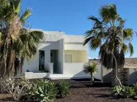 An architectural oasis with large swimming pool, along a breath-taking scenery.