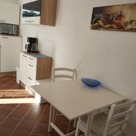 Modern apartment with south-facing terrace near the center.