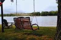 NEW! Renovated Bungalow steps from Lake Tomahawk - King Bed, Dock Space, Firepit