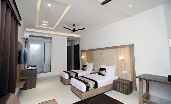 a modern bedroom with two beds , one on the left and one on the right side of the room at Hotel 8th Planet