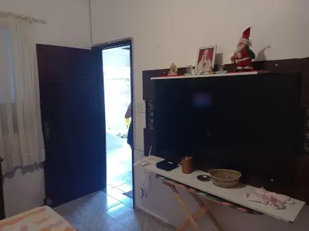 Family home Отели рядом с достопримечательностью «Praia do Boqueirao»