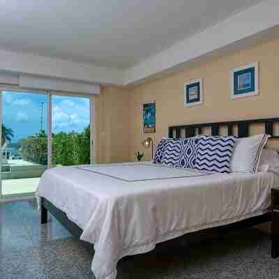 Walk to Eagle Beach – Exclusive 6Br Beachfront Condo with Private Pool & Jacuzzi Rooms