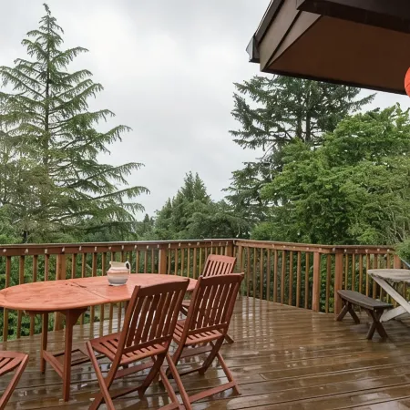 Tabor Hillside Retreat over the trees, walk to trails, and Montavilla cafes.