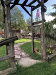 Large Private Fenced Yard with Guest Patio, Fire Pit and Surrounding Gardens.
