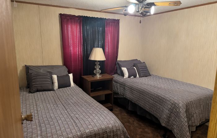 Cozi retreat set in the woods within walking distance of Waubee Lake.