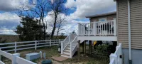 Escape to Our Spacious & Serene 3-Bedroom Home with Stunning Bay Views. - Wi-Fi