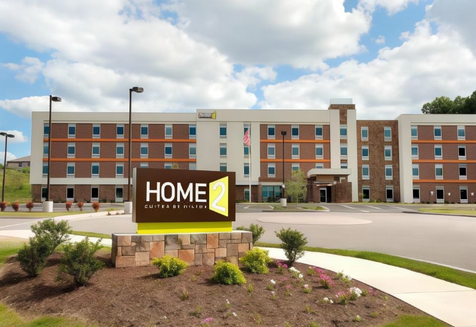 "a large , modern hotel building with the words "" home 2 4 "" prominently displayed on its front" at Home2 Suites by Hilton Pittsburgh/McCandless