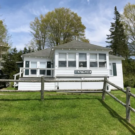 Charming cottage on Lake Willoughby w/ sun porch, private deck and dock.