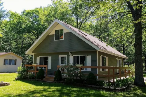 ‘Whispering Oaks’ Cottage with Lake Access, Outdoor Fire Pit and More! - 4-Star