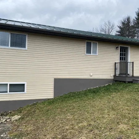 Family friendly cottage, covered deck, close to lake to fish, swim, and boat