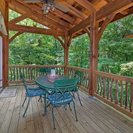A Laurel Haven, with big porches and a log cabin feel. Fireplace.