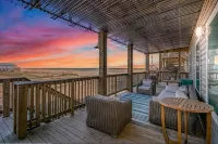 Luxury Beachfront Condo with Covered Deck Steps From Beach & Golf Cart Rental - 4-Star