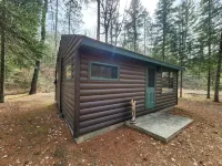 Cozy cabin with backyard stream close to Au Sable River and the best ATV trails Hotels in Oscoda County