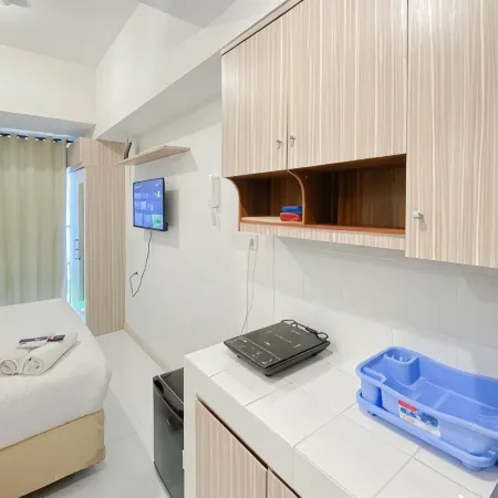 Warm and Simply Studio at Tokyo Riverside PIK 2 Apartment By Travelio