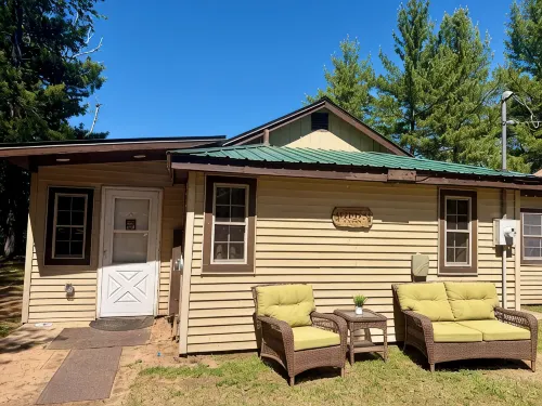 Waterfront Cabin w/ Private Dock & Outdoor Bar near Munising/Manistique - 2-Star