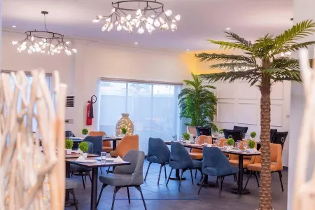 Blue Apple Hotel Отели рядом с достопримечательностью «Элеко Бич»