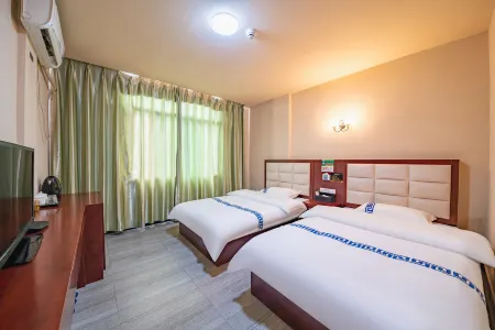 QUANNAN Junjia Business Hotel Отели рядом с достопримечательностью «Quannanxian Library»