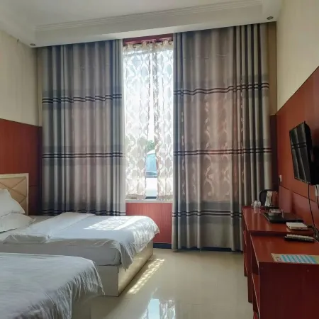 Ruxin Business Hotel (Chengwu Shengshi International Building Materials City)